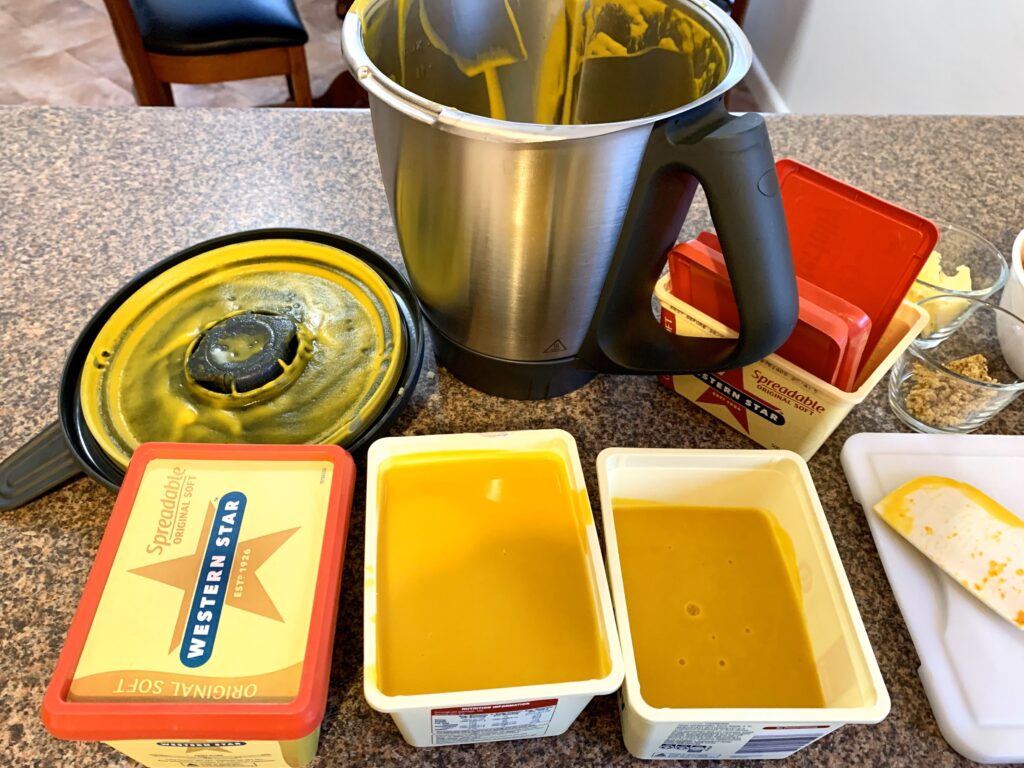 pumpkin soup made in the Thermomix and placed in empty butter containers for freezing #meal prep #pumpkinsoup #thermomix  #freezermeals