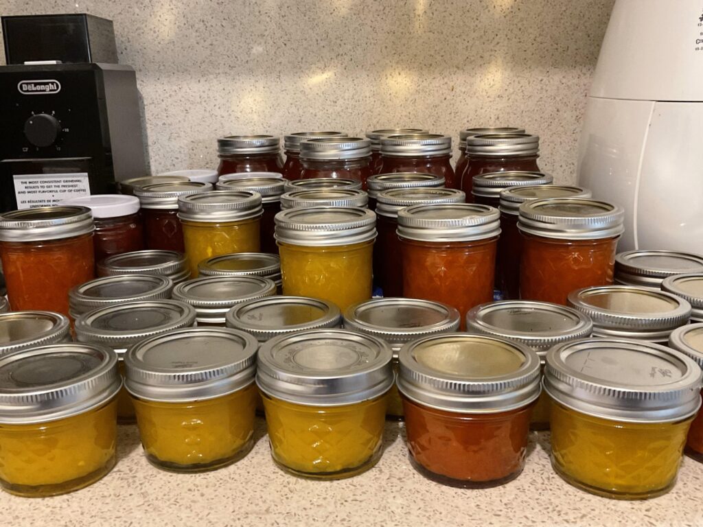 Jars of home made cucumber and tomato relish.