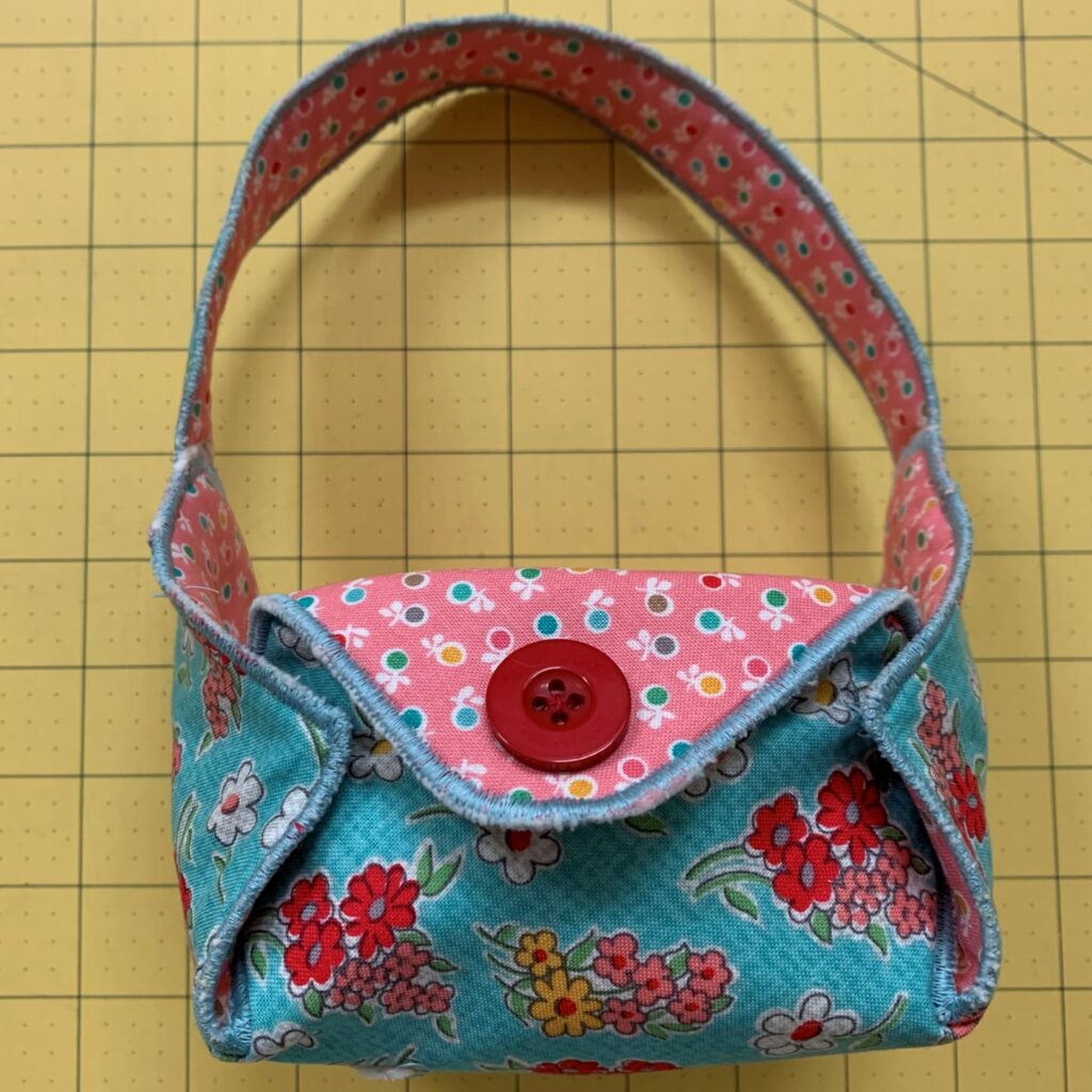 side of fabric basket with button