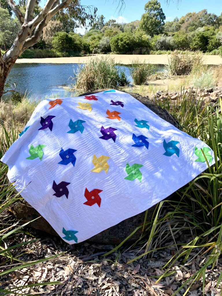 pinwheel quilt near lake