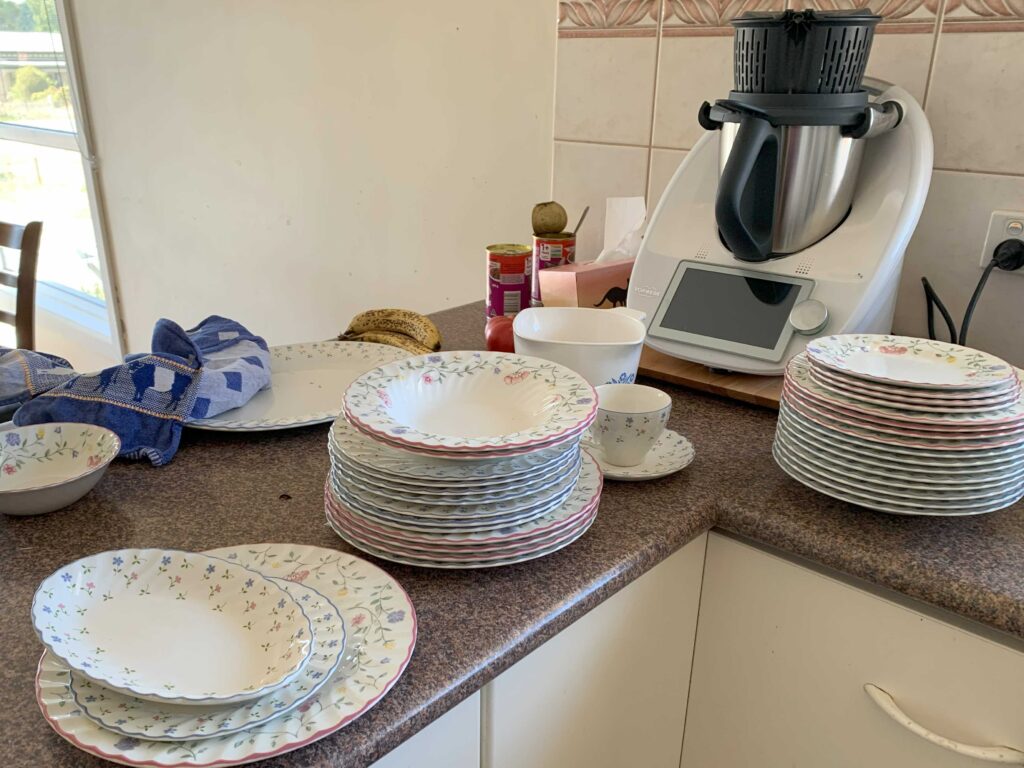 cleaning dishes to go back into cupboard