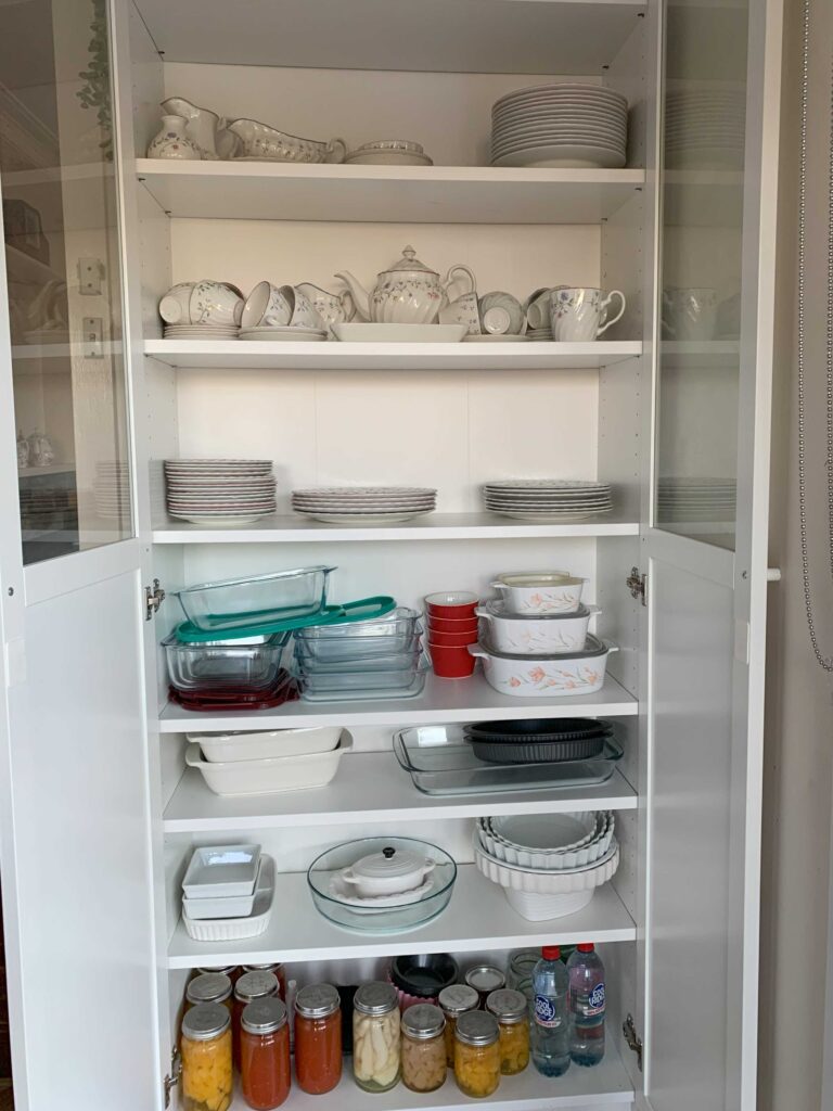 organizing kitchen cupboard